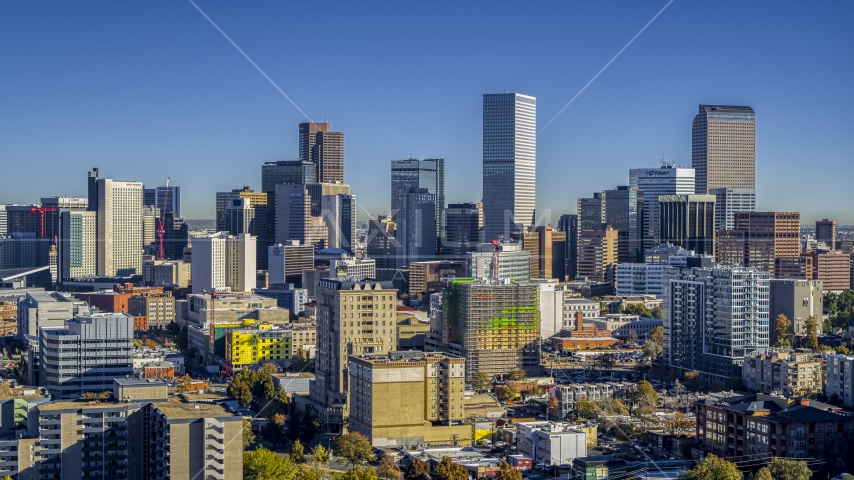 Tall skyscrapers in the city's skyline behind office buildings, Downtown Denver, Colorado Aerial Stock Photo DXP001_000130 | Axiom Images