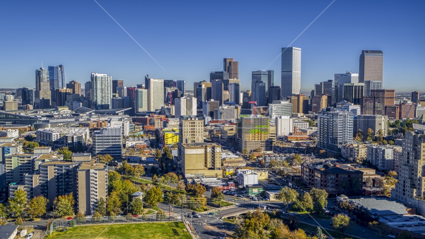 City skyline's tall skyscrapers behind numerous office buildings, Downtown Denver, Colorado Aerial Stock Photo DXP001_000133 | Axiom Images