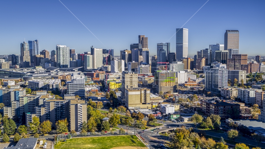 City skyline's tall skyscrapers behind several office buildings, Downtown Denver, Colorado Aerial Stock Photo DXP001_000135 | Axiom Images