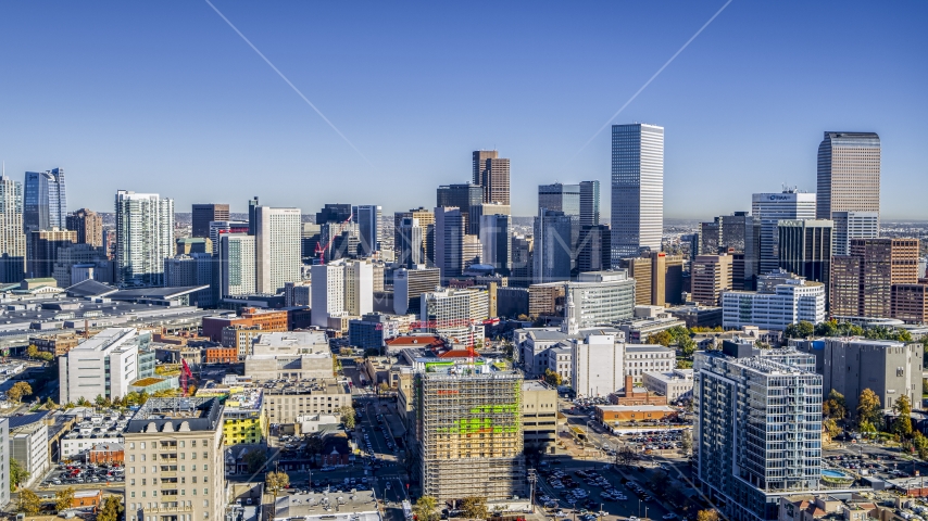 City skyline's giant skyscrapers behind several office buildings, Downtown Denver, Colorado Aerial Stock Photo DXP001_000136 | Axiom Images