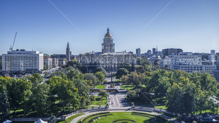 The Colorado State Capitol seen from tree-lined Civic Center Park in Downtown Denver, Colorado Aerial Stock Photo DXP001_000147 | Axiom Images