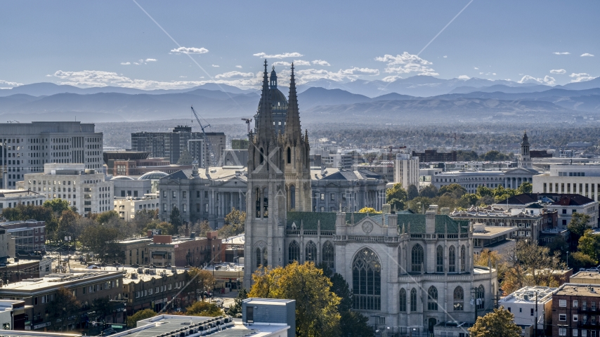 A cathedral with mountains in the background, Downtown Denver, Colorado Aerial Stock Photo DXP001_000168 | Axiom Images