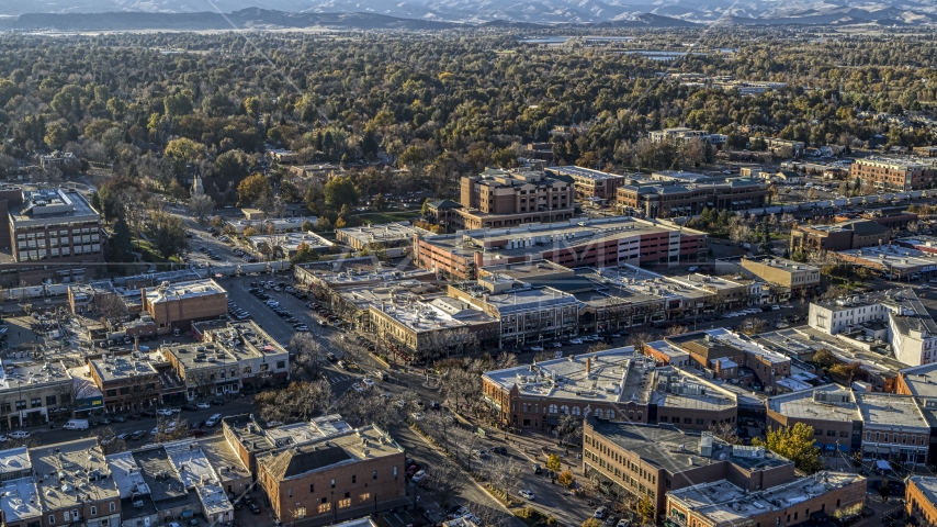 Shops and brick office buildings beside a quiet street in Fort Collins, Colorado Aerial Stock Photo DXP001_000241 | Axiom Images