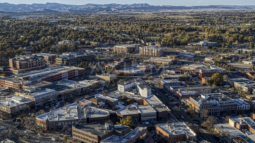 Small shops lining a busy town road in Fort Collins, Colorado Aerial Stock Photo DXP001_000250 | Axiom Images