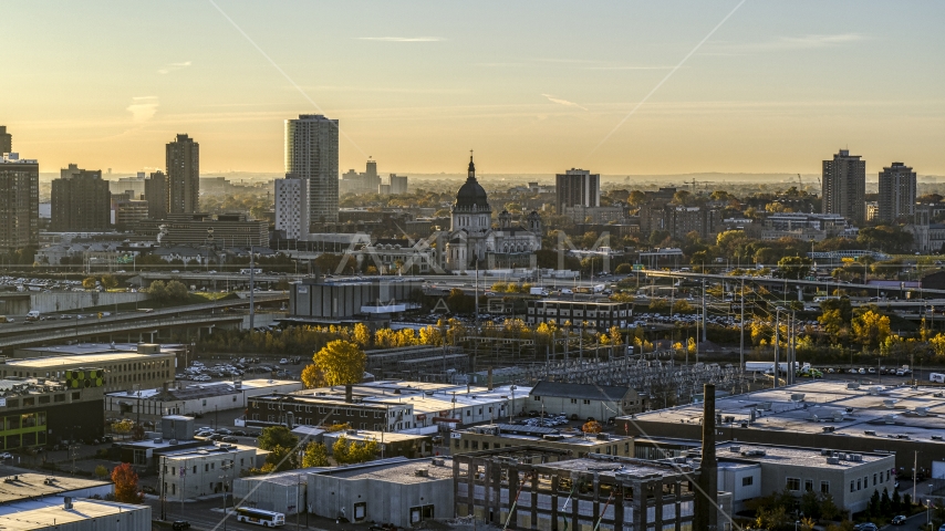 The bright, rising sun behind giant skyscrapers in the city's skyline in Downtown Minneapolis, Minnesota Aerial Stock Photo DXP001_000271 | Axiom Images