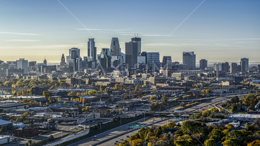 A view of the city skyline's skyscrapers at sunrise seen from trees in Downtown Minneapolis, Minnesota Aerial Stock Photo DXP001_000277 | Axiom Images