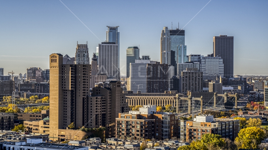 The city skyline's skyscrapers behind condo complex at sunrise, Downtown Minneapolis, Minnesota Aerial Stock Photo DXP001_000280 | Axiom Images