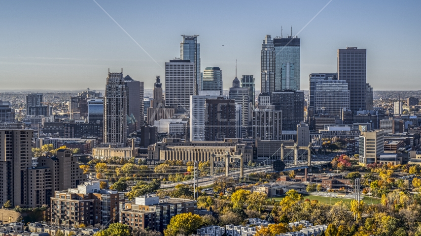 The city skyline's skyscrapers seen from near a condo complex at sunrise, Downtown Minneapolis, Minnesota Aerial Stock Photo DXP001_000283 | Axiom Images