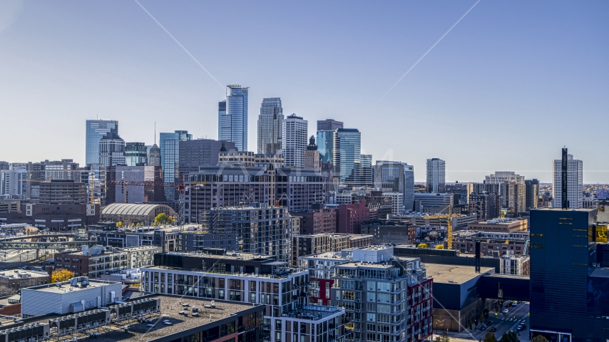 Office buildings with city skyline's skyscrapers in the background, Downtown Minneapolis, Minnesota Aerial Stock Photo DXP001_000303 | Axiom Images