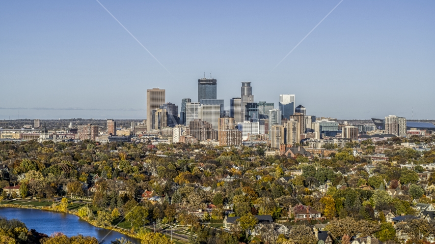 Lakefront homes and city skyline seen from Lake of the Isles, Downtown Minneapolis, Minnesota Aerial Stock Photo DXP001_000317 | Axiom Images