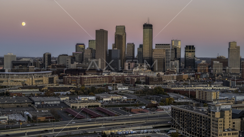 The moon in the sky near the tall skyscrapers of the city's skyline at twilight, Downtown Minneapolis, Minnesota Aerial Stock Photo DXP001_000332 | Axiom Images