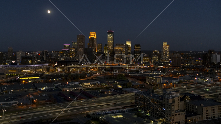 The downtown skyline at twilight and the moon in the sky above, Downtown Minneapolis, Minnesota Aerial Stock Photo DXP001_000351 | Axiom Images