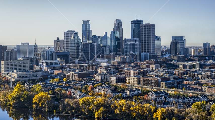 The downtown skyline and city buildings seen from the river, Downtown Minneapolis, Minnesota Aerial Stock Photo DXP001_000361 | Axiom Images