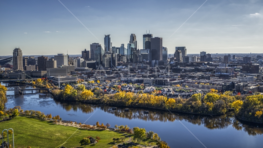 City skyline seen from the Mississippi River with fall trees, Downtown Minneapolis, Minnesota Aerial Stock Photo DXP001_000399 | Axiom Images