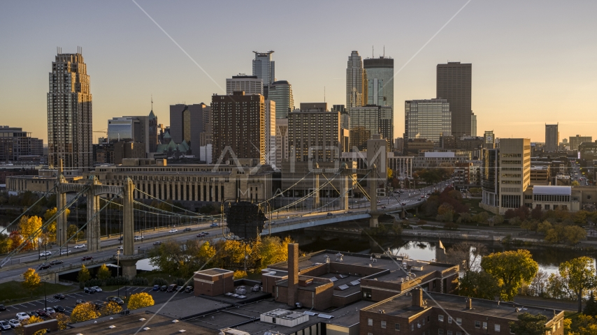 Hennepin Avenue Bridge spanning the river at sunset, with the skyline in the background, Downtown Minneapolis, Minnesota Aerial Stock Photo DXP001_000420 | Axiom Images