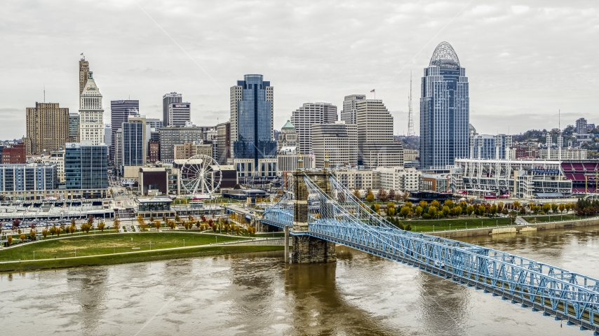 City's skyline and the Roebling Bridge across the Ohio River, Downtown Cincinnati, Ohio Aerial Stock Photo DXP001_000476 | Axiom Images