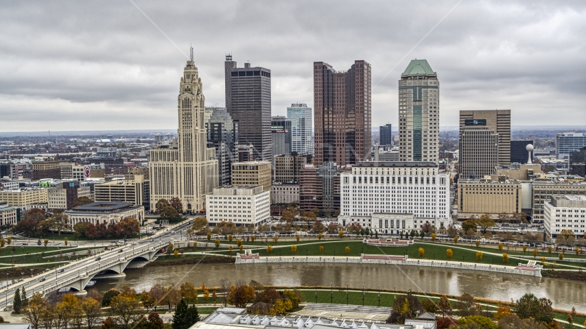 Towering skyscrapers of the city's downtown skyline on the opposite side of the river, Downtown Columbus, Ohio Aerial Stock Photo DXP001_000493 | Axiom Images