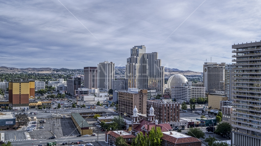 Top of the Saint Thomas Aquinas Cathedral with view of Silver Legacy Resort Casino in Reno, Nevada Aerial Stock Photo DXP001_006_0016 | Axiom Images