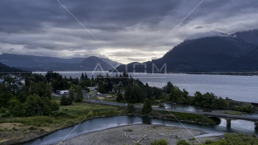 The Columbia River and cloud-shrouded mountains at sunrise, Stevenson, Washington Aerial Stock Photo DXP001_008_0001 | Axiom Images