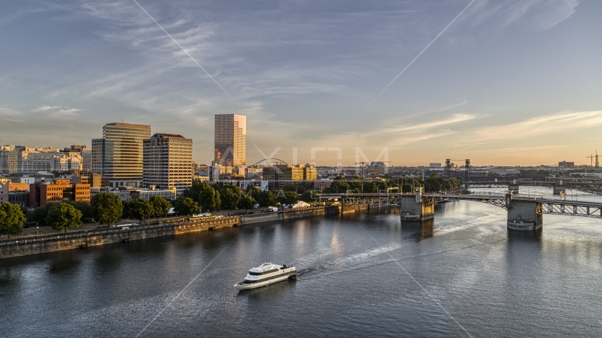 Office buildings, skyscrapers, and the Morrison Bridge seen from the Willamette River, Downtown Portland, Oregon Aerial Stock Photo DXP001_010_0009 | Axiom Images