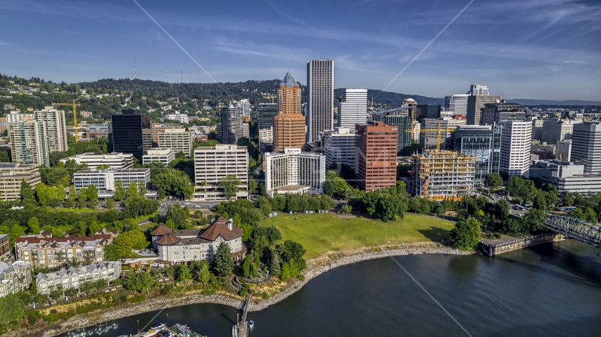 Office buildings and towering skyscrapers near the river in Downtown Portland, Oregon Aerial Stock Photo DXP001_011_0014 | Axiom Images