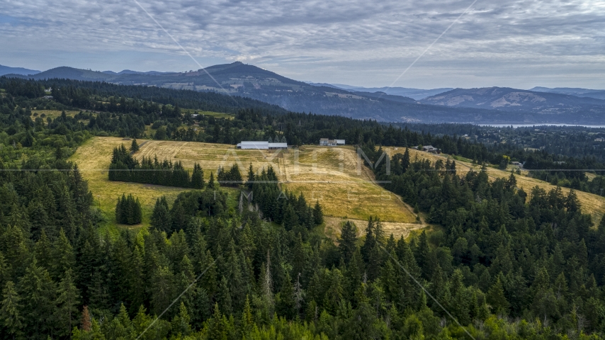 A farm and open fields in Hood River, Oregon Aerial Stock Photo DXP001_015_0009 | Axiom Images