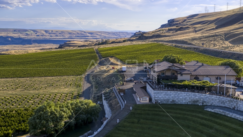 The Maryhill Winery and surrounding vineyard seen from the amphitheater in Goldendale, Washington Aerial Stock Photo DXP001_019_0019 | Axiom Images