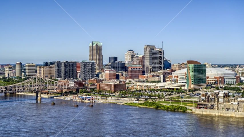 A view of riverfront office buildings near a bridge with Arch in the background, Downtown St. Louis, Missouri Aerial Stock Photo DXP001_023_0010 | Axiom Images