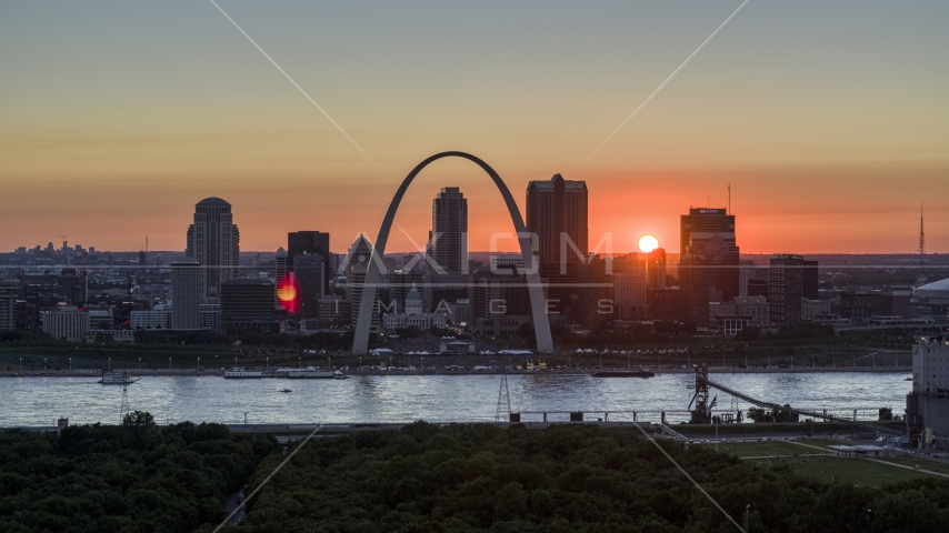 Famous Gateway Arch and the Downtown St. Louis, Missouri skyline in silhouette at sunset Aerial Stock Photo DXP001_029_0011 | Axiom Images