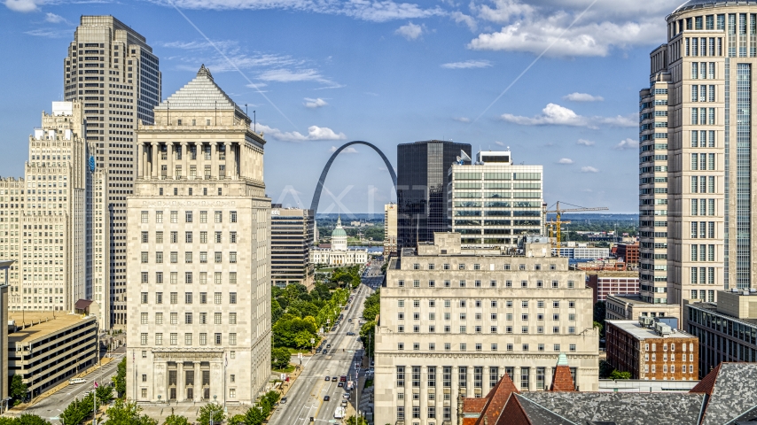 The Gateway Arch and museum visible between courthouses in Downtown St. Louis, Missouri Aerial Stock Photo DXP001_031_0005 | Axiom Images