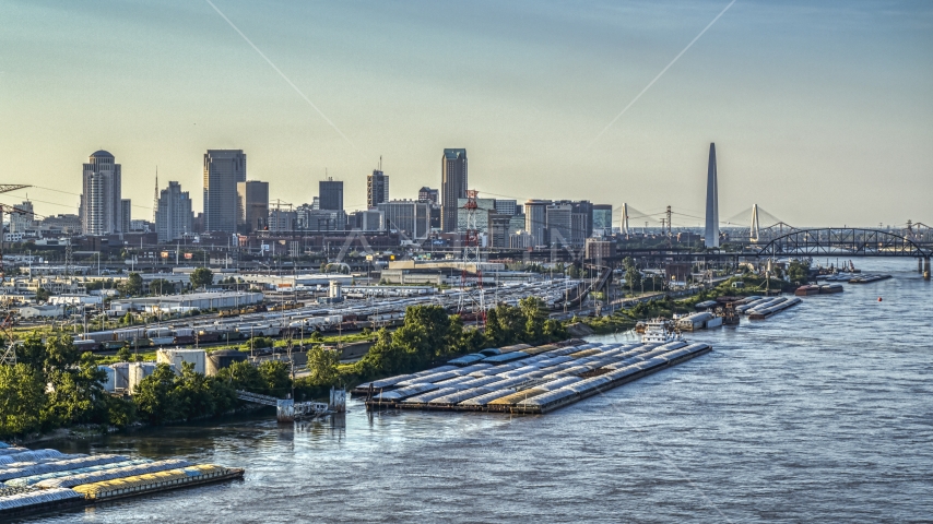 The city's skyscrapers and Gateway Arch seen from barges on the Mississippi River, Downtown St. Louis, Missouri Aerial Stock Photo DXP001_034_0001 | Axiom Images