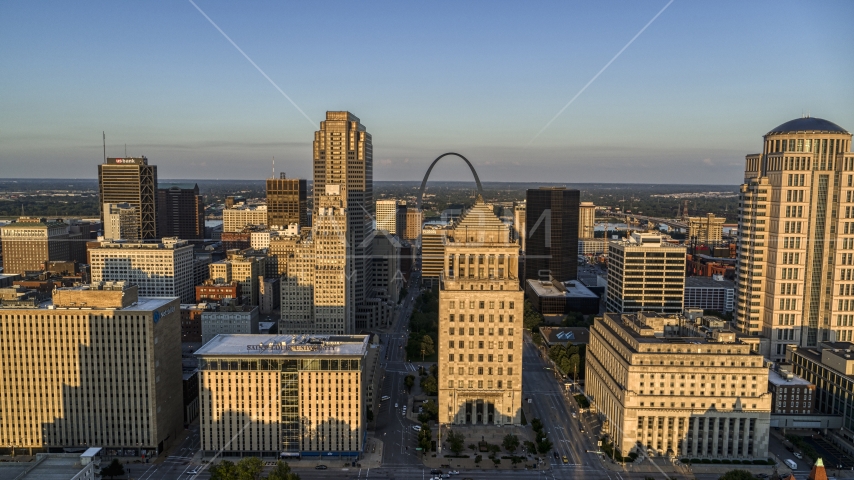 Courthouses near the Gateway Arch at sunset, Downtown St. Louis, Missouri Aerial Stock Photo DXP001_035_0002 | Axiom Images