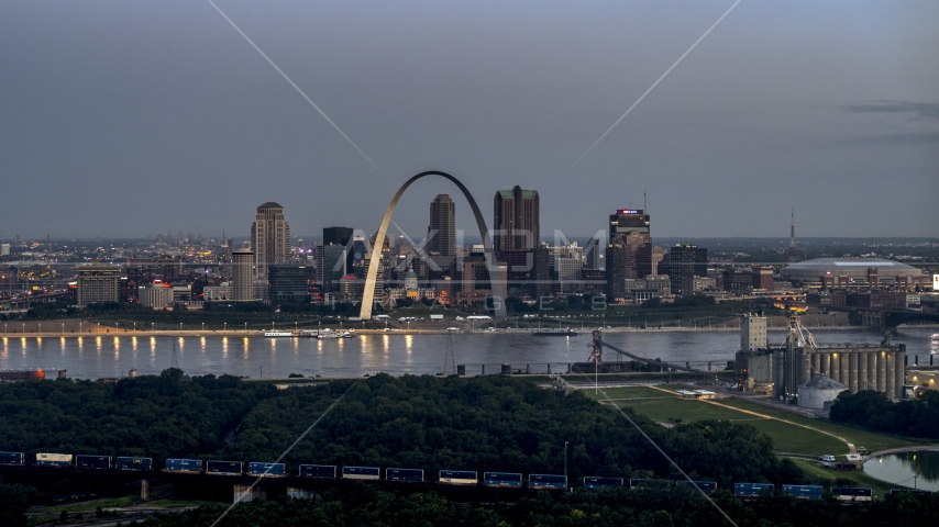 A view of the Gateway Arch and the Mississippi River at twilight, Downtown St. Louis, Missouri Aerial Stock Photo DXP001_037_0012 | Axiom Images