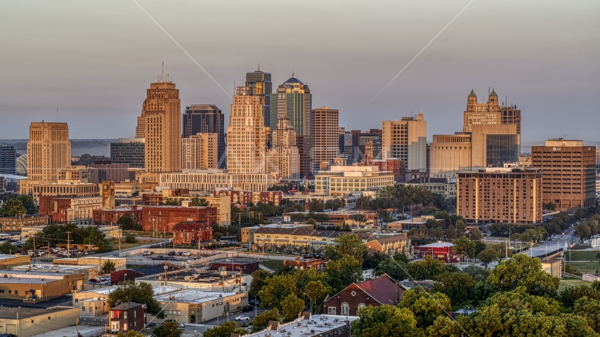 The city skyline seen from trees at sunrise, Downtown Kansas City, Missouri Aerial Stock Photo DXP001_040_0002 | Axiom Images