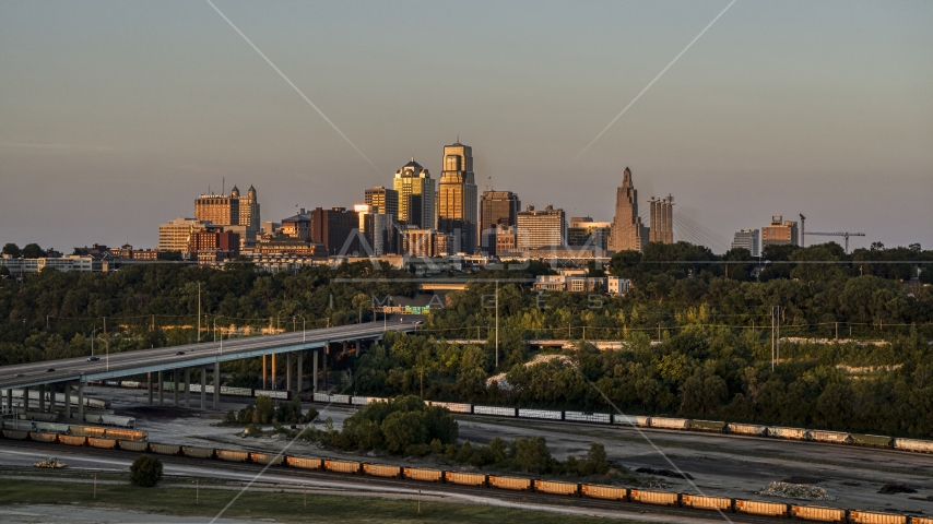 The city skyline at sunset seen from train tracks in Downtown Kansas City, Missouri Aerial Stock Photo DXP001_046_0002 | Axiom Images