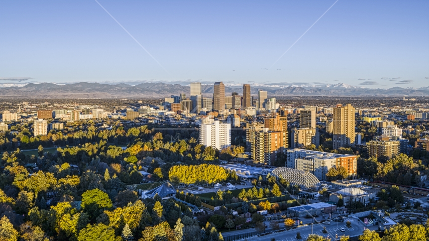 Skyscrapers in Downtown Denver, Colorado at sunrise behind apartment buildings Aerial Stock Photo DXP001_052_0004 | Axiom Images