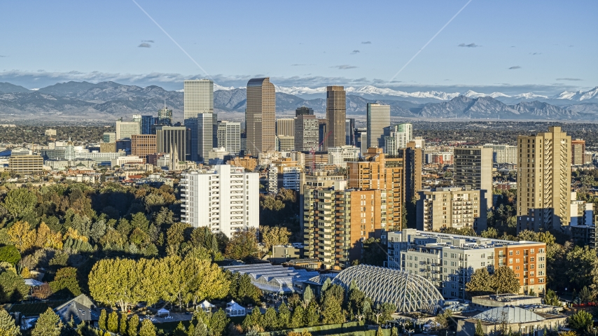 Tall skyscrapers in Downtown Denver, Colorado at sunrise, seen from apartment buildings Aerial Stock Photo DXP001_052_0006 | Axiom Images