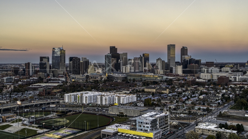 Wide view of the city's skyline at sunset, Downtown Denver, Colorado Aerial Stock Photo DXP001_057_0001 | Axiom Images