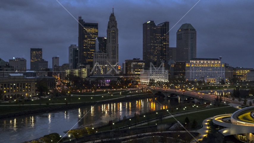 The city skyline across the river at twilight, Downtown Columbus, Ohio Aerial Stock Photo DXP001_088_0001 | Axiom Images