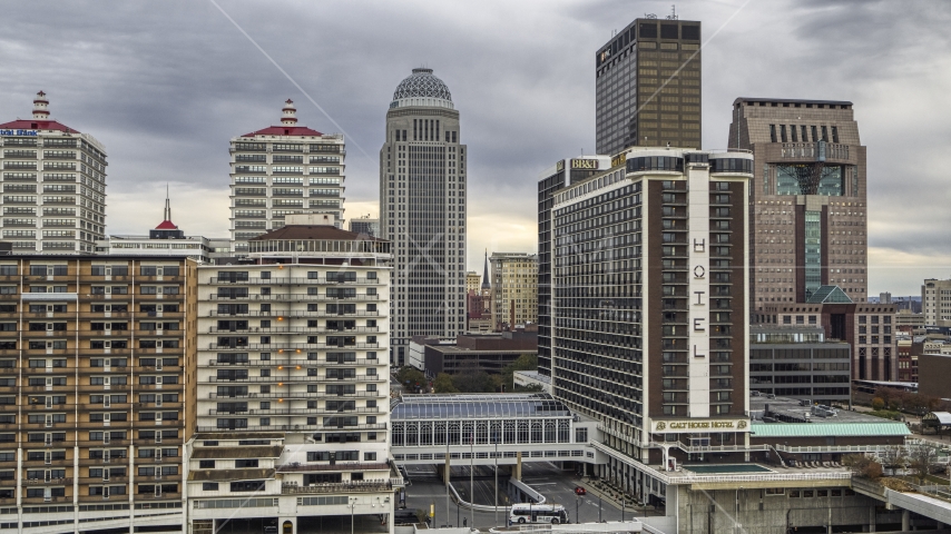 Skyscrapers behind riverfront hotel in Downtown Louisville, Kentucky Aerial Stock Photo DXP001_095_0014 | Axiom Images