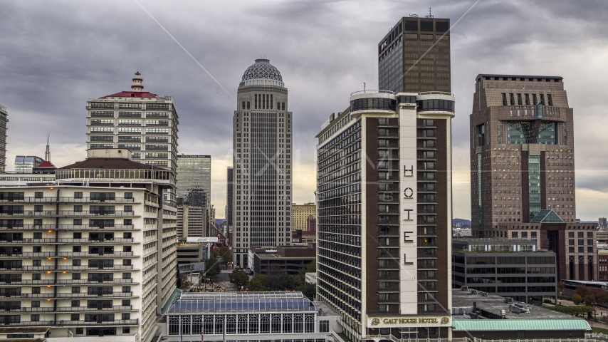 High-rise hotel with skyscrapers in background, Downtown Louisville, Kentucky Aerial Stock Photo DXP001_095_0015 | Axiom Images