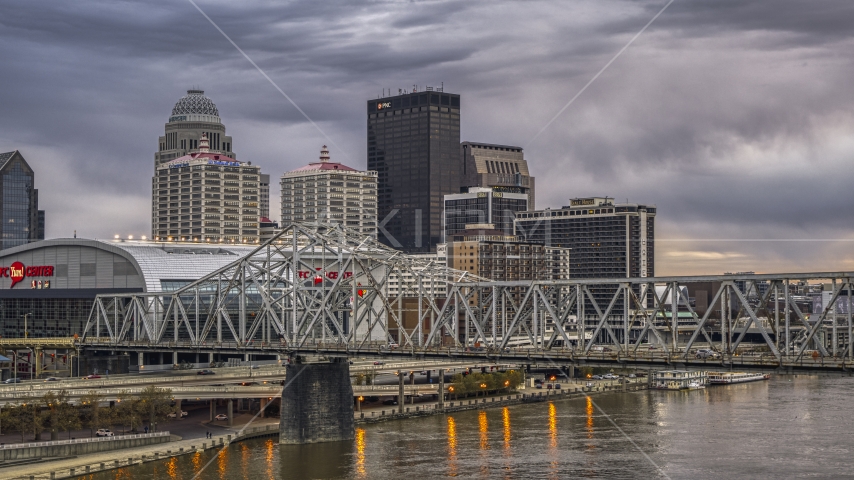 The downtown skyline lit up at twilight, seen from Ohio River, Downtown Louisville, Kentucky Aerial Stock Photo DXP001_096_0004 | Axiom Images