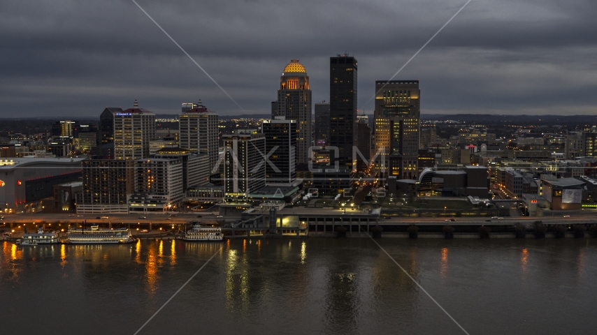 Skyscrapers and city buildings at night in Downtown Louisville, Kentucky Aerial Stock Photo DXP001_096_0012 | Axiom Images