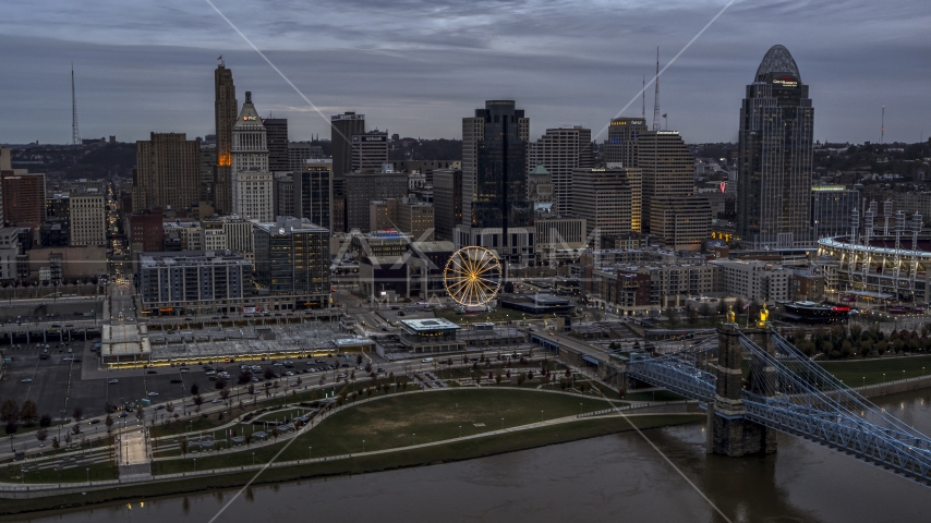 The city skyline's skyscrapers at sunset, seen from Ohio River, Downtown Cincinnati, Ohio Aerial Stock Photo DXP001_097_0012 | Axiom Images