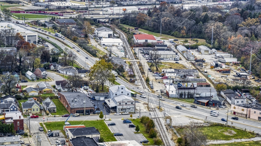 A busy street and railroad tracks in industrial area in Lexington, Kentucky Aerial Stock Photo DXP001_099_0010 | Axiom Images