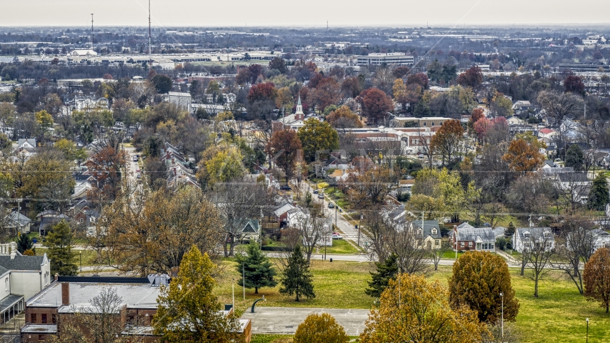 A church steeple behind suburban neighborhood in Lexington, Kentucky Aerial Stock Photo DXP001_099_0014 | Axiom Images