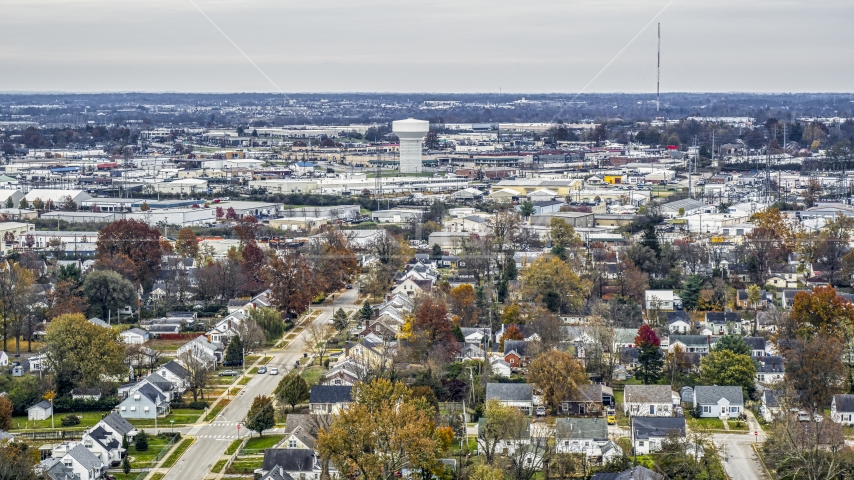 Homes with view of a water tower surrounded by warehouses in Lexington, Kentucky Aerial Stock Photo DXP001_099_0017 | Axiom Images