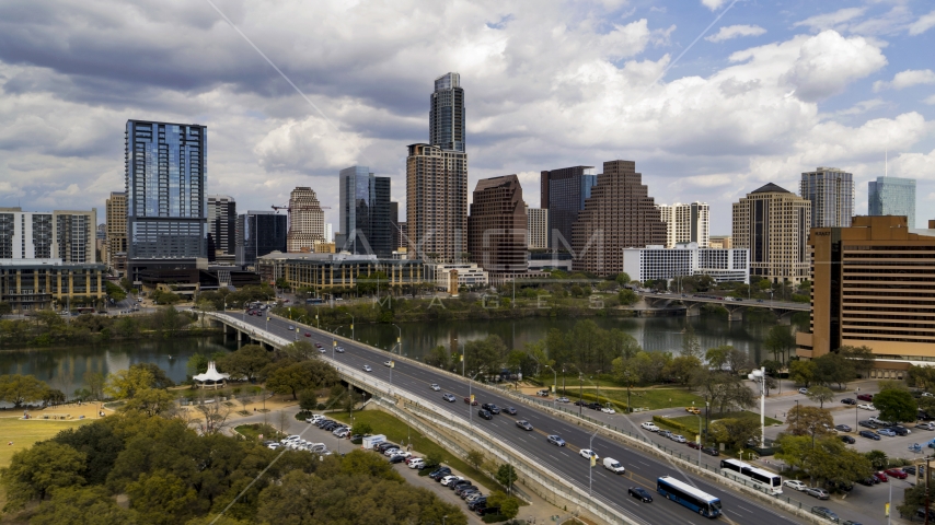 A view of the city's skyline from First Street Bridge and Lady Bird Lake, Downtown Austin, Texas Aerial Stock Photo DXP002_102_0003 | Axiom Images