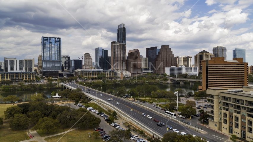 Cars on First Street Bridge spanning Lady Bird Lake with view of skyline, Downtown Austin, Texas Aerial Stock Photo DXP002_102_0005 | Axiom Images