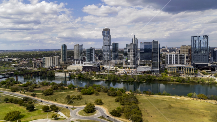 City skyscrapers across Lady Bird Lake, Downtown Austin, Texas Aerial Stock Photo DXP002_102_0012 | Axiom Images